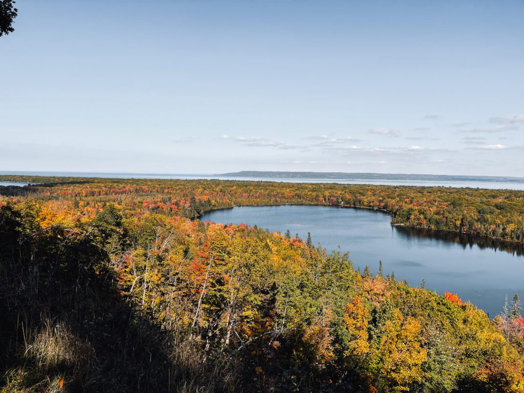 Fall in the upper peninsula fall colored leaves surrounded by water in the upper peninsula